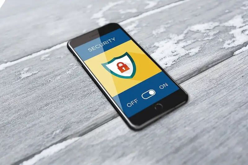 The image shows a smartphoone on the table. On its screen its writeen "Security", then there is a lock image and under it's written "Off, On". 