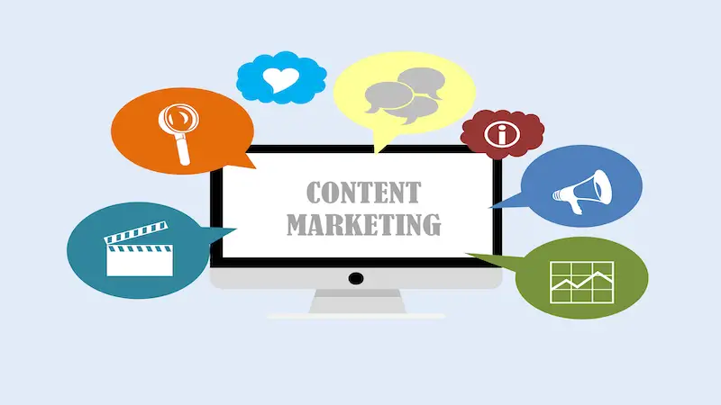 THe image shows a computer screen where it's written "Content Marketing", around it there are several speech baloons.