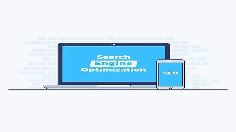 The image shows a laptop, where it's written "Search Engine Optimization", and a smartphone, where it's written "SEO".