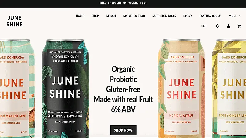June Shine's website page. The image shows several  June Shine's cans and in the middle of the image it's written "Organic, Probiotic, Gluten-free, Made with real fruit, 6% ABV. Shop now"