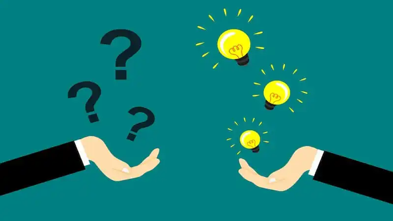 On the left side of the image there is a hand with the palm up, and above it, there are several question marks. On the right side of the image there is another hand with the palm up with several light bulbs above it. 