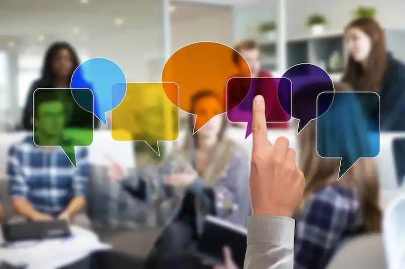The image shows someone pointing to speech baloons. 