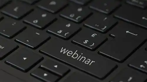 Webinar features The image shows a keyboard. In one of the keyboard keys it's written "webinar".