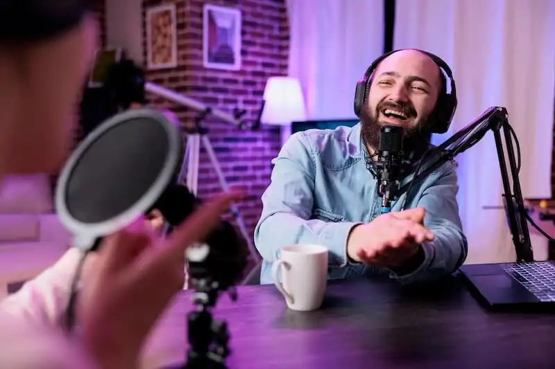 Best resources for ACCA courses - podcasts The image shows a man recording a podcast.