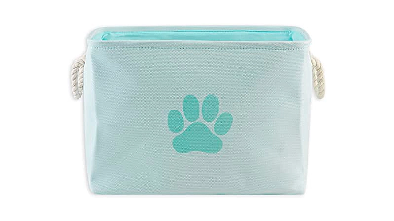 imagem de uma caixa organizadora de brinquedos de pet na cor azul e estampa de pata