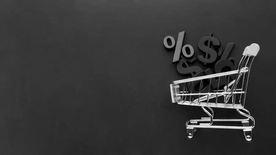 Carrito de compras con símbolos de porcentaje y dinero