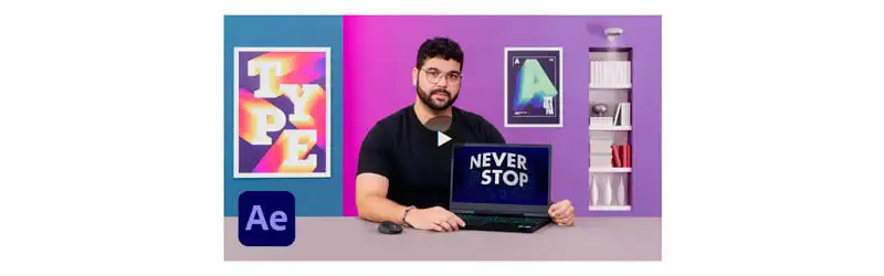 Curso de Animação Tipográfica Professor Érico Santa segurando um notebook com o texto "Never Stop" em sua tela