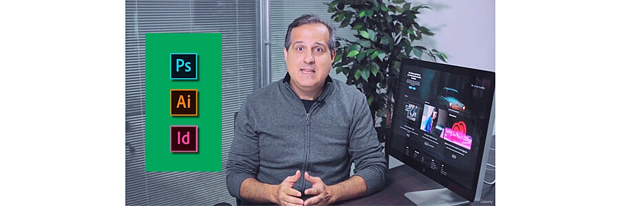 instrutor explicando sobre o curso de photoshop ao lado de um computador Mac