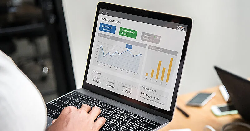 An laptop screen shows several graphics.