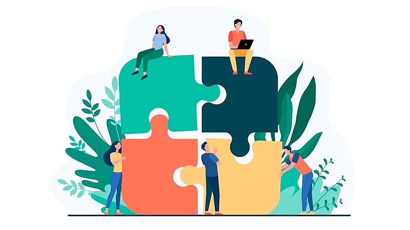 Equipe montando um quebra-cabeça