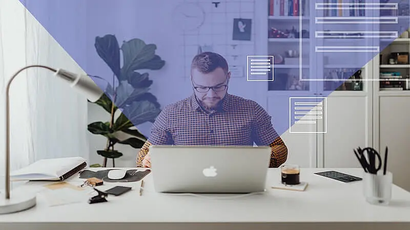 The image shows a man in his office, he is in front of a computer where pages icons a going out of it