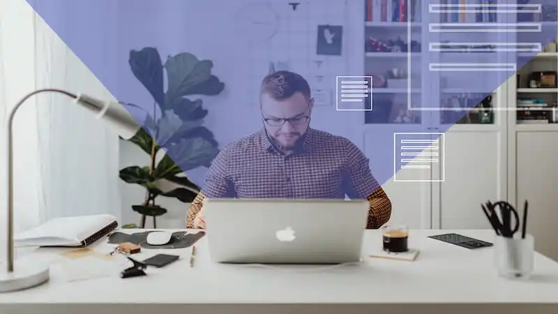 The image shows a man in his office, he is in front of a computer where pages icons a going out of it