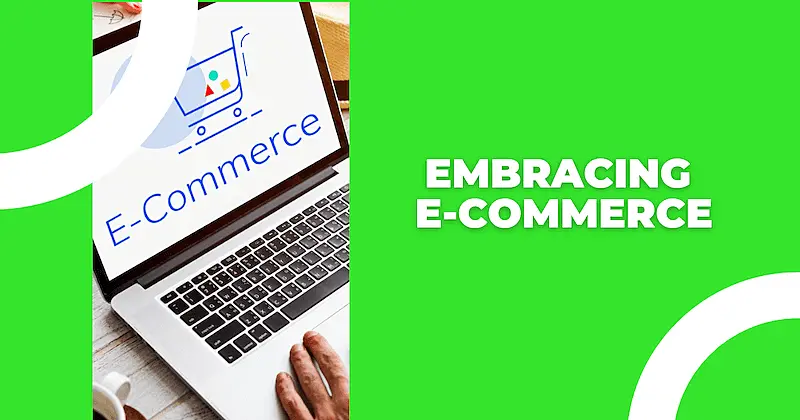 The image shows a laptop, in the screen it's written "E-commerce".