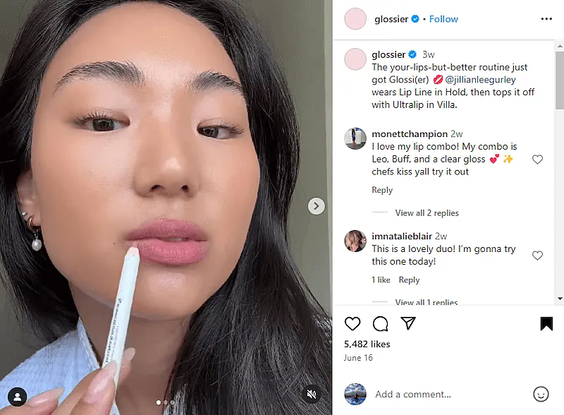 Glossier Instagram post showing a girl applying a lip liner in her lips.