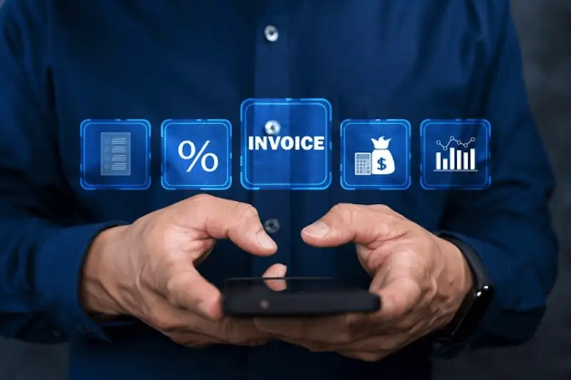 How IoT and blockchain are changing billing - smart invoices The image shows a man using a smartphone