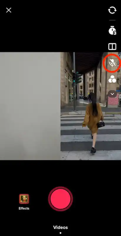 The image shows a dute video. On the right side a girl is shown from the back walking  on the street and on the left side a white screen is shown.