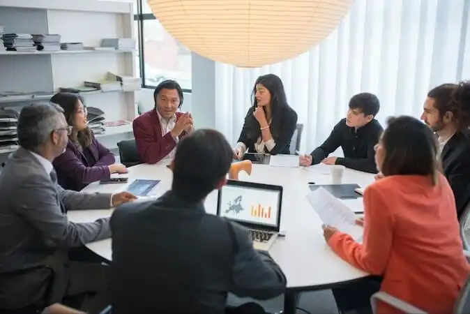Team of employees in a company meeting.