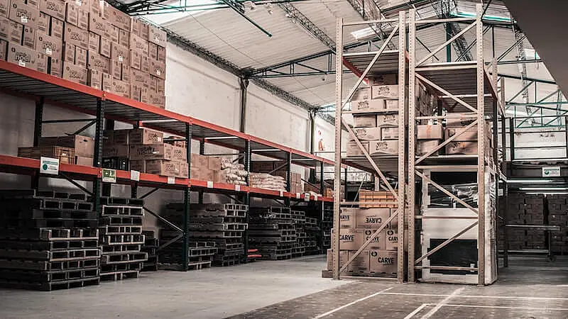 THe image shows a warehouse with several packages