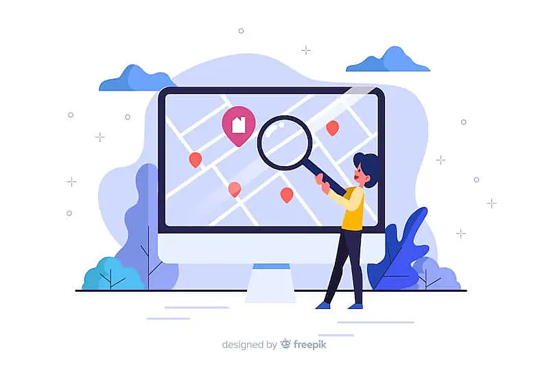 The image shows someone using a magnifying glass pointing to a map in a computer screen.