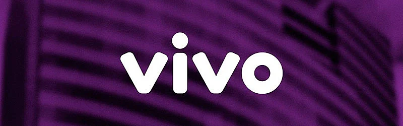 Foto de um prédio com filtro roxo e logo da vivo