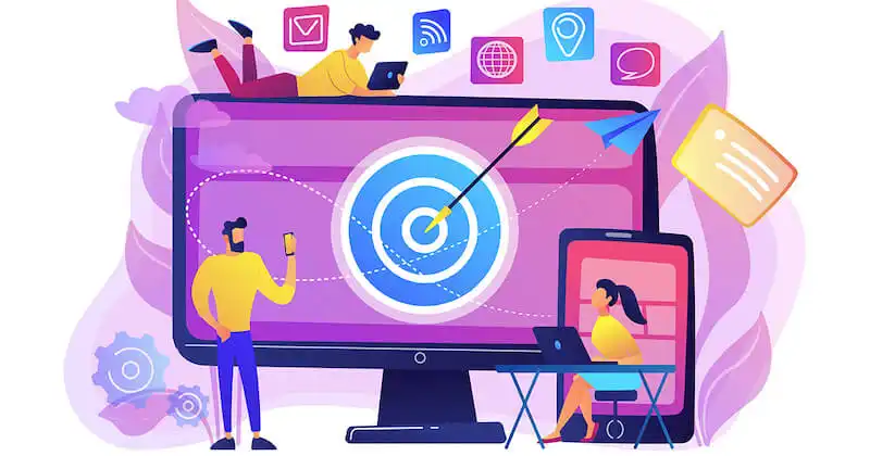 Creating social media content for e-commerce setting objectives Illustration showing a computer screen, with a person on the side holdin a smartphone, one sitting in front of it using a laptop, and another one above the computer using a tablet.