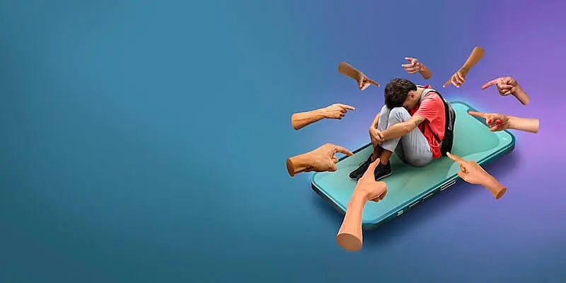 A boy is sitting on a smartphone with his head on his knees, around him are several fingers pointing to him.