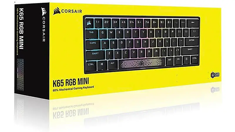 imagem de um teclado mecânico Corsair K65 na cor preta com iluminação colorida